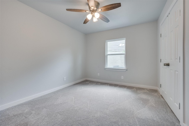 unfurnished bedroom with light carpet and ceiling fan