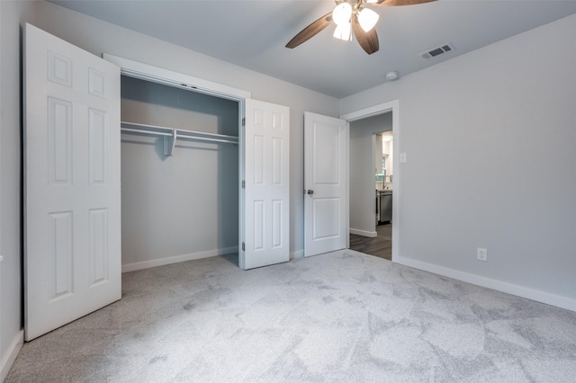 unfurnished bedroom featuring ceiling fan, carpet floors, and a closet