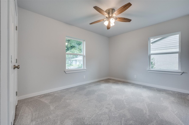 carpeted empty room with ceiling fan