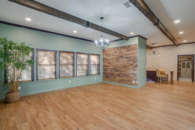 162 Eastledge Dr, Graham, TX 76450 - unfurnished living room featuring beamed ceiling, a chandelier, baseboards, light wood finished floors, and recessed lighting