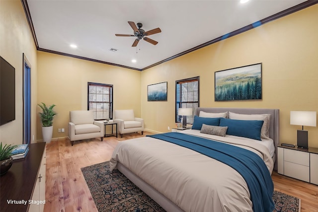 bedroom with light wood-type flooring, crown molding, and ceiling fan