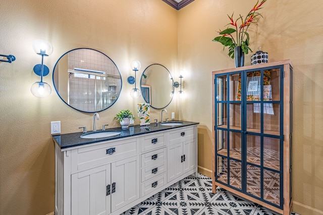 bathroom with tile patterned flooring and vanity