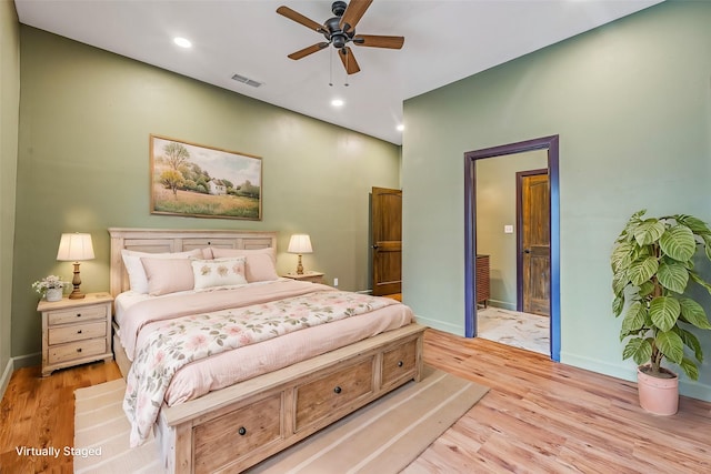 bedroom with ceiling fan and light hardwood / wood-style flooring