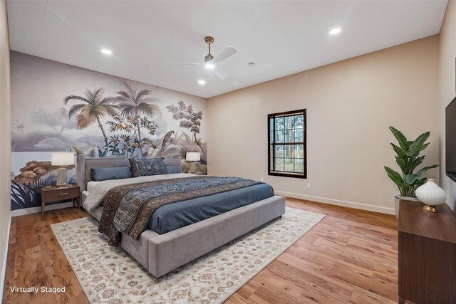 bedroom featuring light hardwood / wood-style floors and ceiling fan