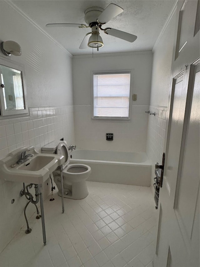 bathroom with tile walls, tile patterned flooring, ornamental molding, and toilet