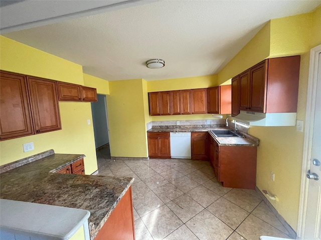 kitchen featuring light tile patterned flooring, sink, white dishwasher, and kitchen peninsula