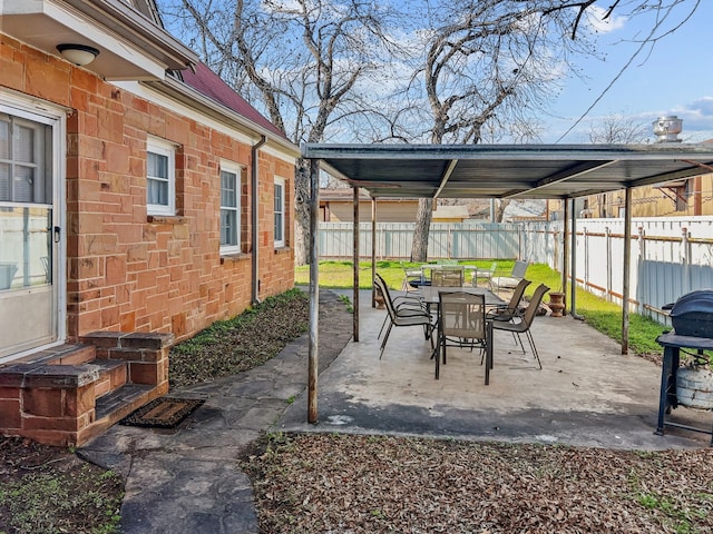 view of patio featuring outdoor dining area and a fenced backyard