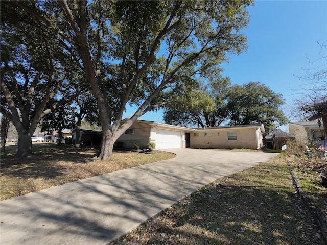 single story home featuring a garage