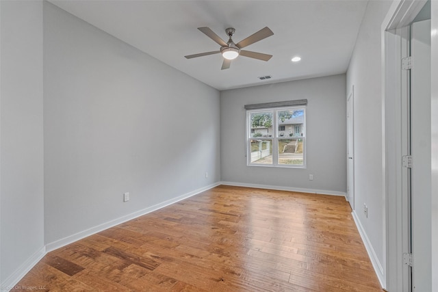 spare room featuring ceiling fan and light hardwood / wood-style flooring