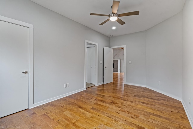 unfurnished bedroom featuring light hardwood / wood-style flooring and ceiling fan