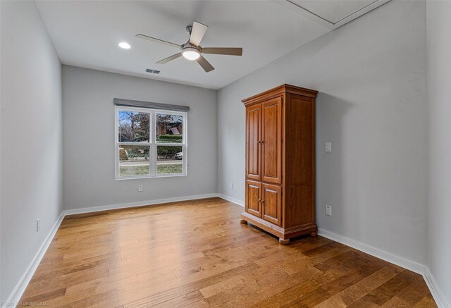 8216 Coolgreene Dr, Dallas, TX 75228 - unfurnished bedroom with light wood-style flooring, ceiling fan, and baseboards