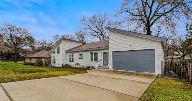 ranch-style home featuring a garage and a front yard