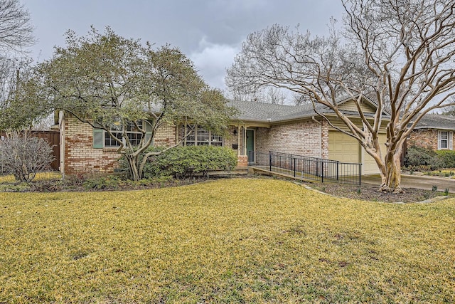 view of front of property with a garage and a front yard