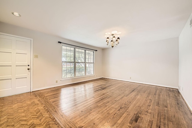 interior space featuring hardwood / wood-style flooring and a notable chandelier