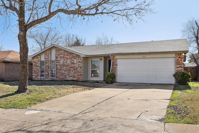 ranch-style house featuring a garage