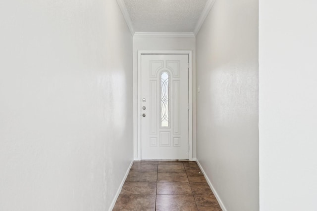 entryway with ornamental molding and a textured ceiling