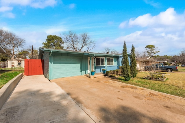 single story home with a garage and a front yard