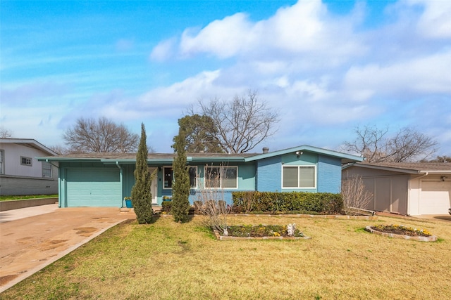 ranch-style home with a garage and a front lawn