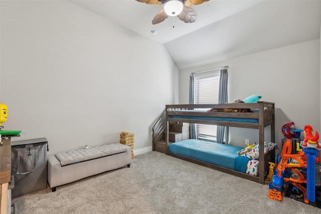 bedroom featuring ceiling fan, vaulted ceiling, and light carpet