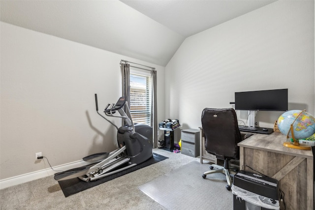 carpeted office featuring lofted ceiling