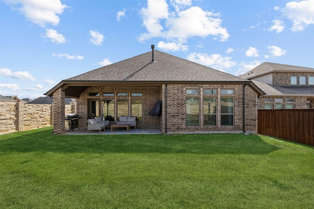 rear view of property with an outdoor living space, a yard, and a patio area