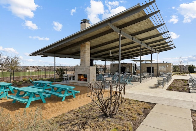 exterior space featuring a gazebo and an outdoor stone fireplace