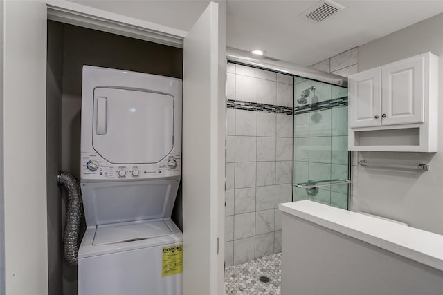 laundry room featuring stacked washer and dryer