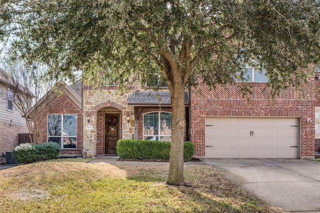 view of front of house with a garage and a front lawn