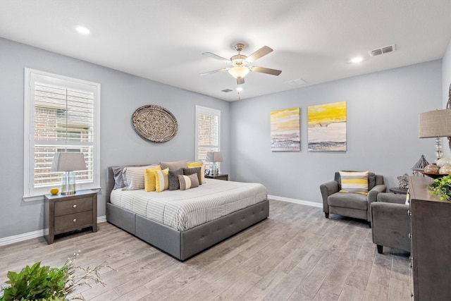 bedroom with ceiling fan and light wood-type flooring