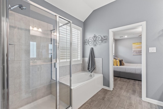 bathroom with wood-type flooring, plus walk in shower, and vaulted ceiling