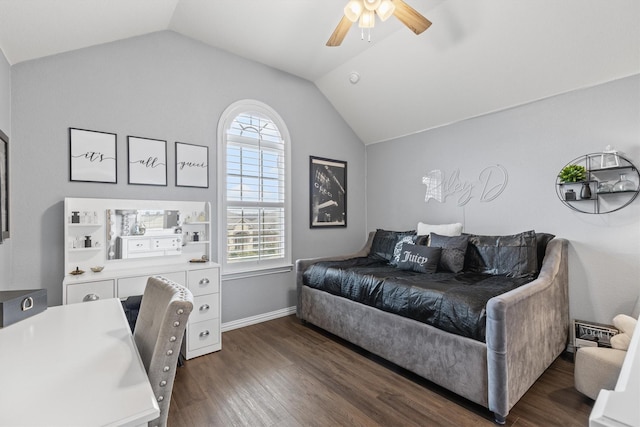 bedroom featuring ceiling fan, lofted ceiling, and dark hardwood / wood-style floors