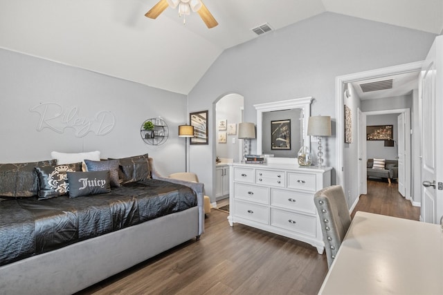 bedroom featuring ceiling fan, lofted ceiling, and dark hardwood / wood-style flooring