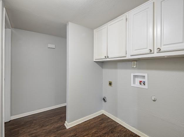 laundry area with cabinets, washer hookup, dark hardwood / wood-style floors, and electric dryer hookup