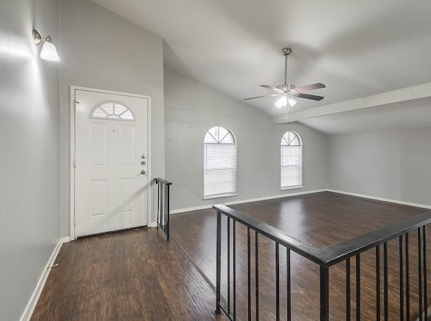 entryway featuring ceiling fan, dark hardwood / wood-style floors, and vaulted ceiling