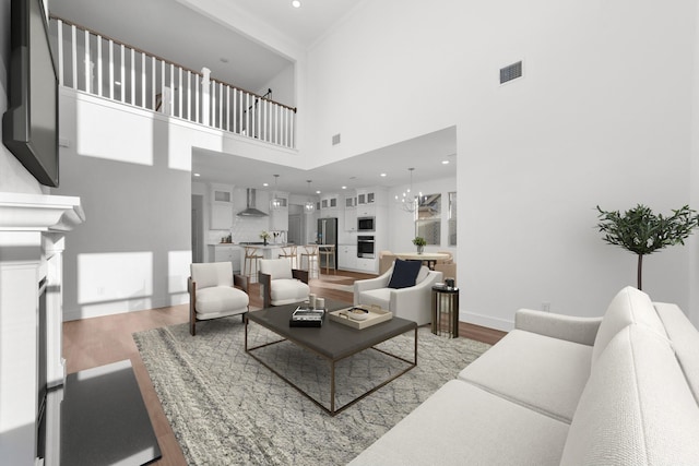 living room featuring an inviting chandelier and hardwood / wood-style flooring