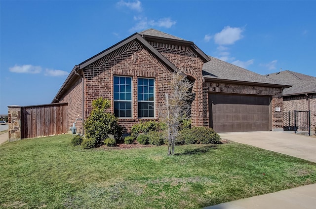 front facade featuring a garage and a front lawn