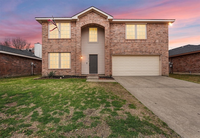 front of property with a garage and a yard