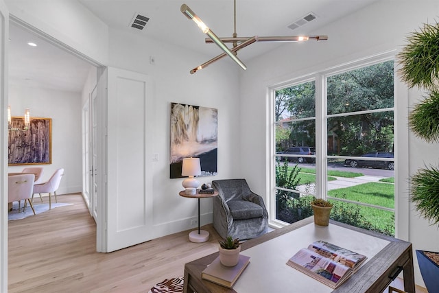 4529 Fairway, Highland Park, TX 75219 - sitting room with light wood finished floors, a chandelier, and baseboards