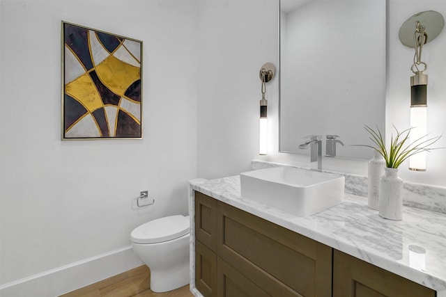 4529 Fairway, Highland Park, TX 75219 - bathroom featuring toilet, vanity, and wood finished floors