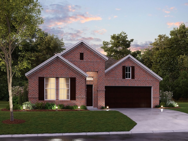 view of property featuring a garage and a lawn