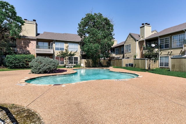 4113 Esters Rd Unit 609, Irving, TX 75038 - community pool featuring central AC unit and fence
