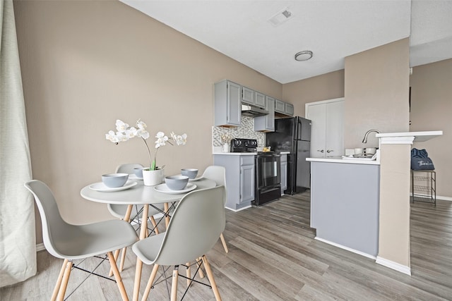 4113 Esters Rd Unit 609, Irving, TX 75038 - dining area featuring wood finished floors, baseboards, and visible vents