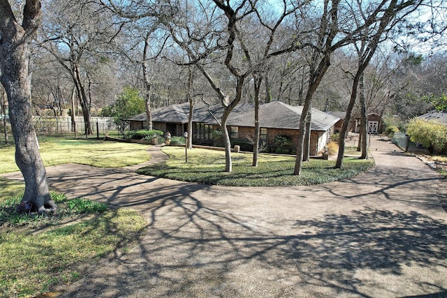 ranch-style home featuring a front yard