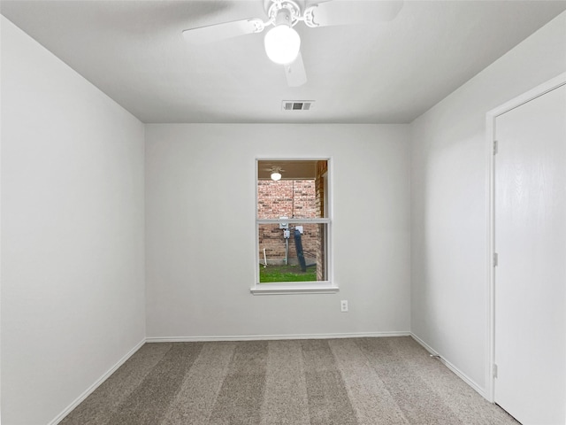 carpeted empty room with ceiling fan