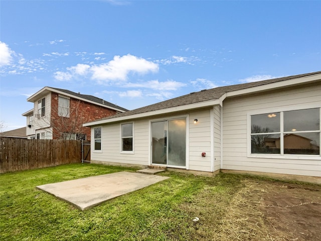 back of house featuring a yard and a patio