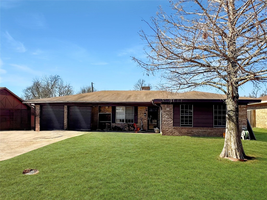 single story home with a garage and a front yard