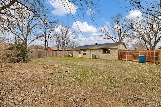 view of yard with a fenced backyard and cooling unit