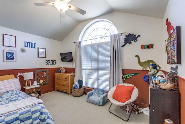 bedroom featuring lofted ceiling, light carpet, and ceiling fan