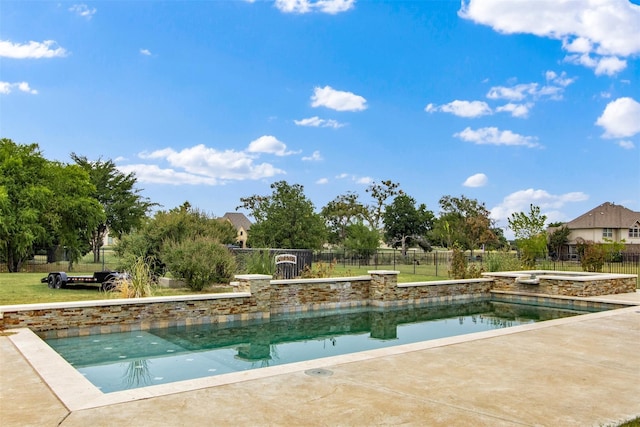 view of pool with an in ground hot tub