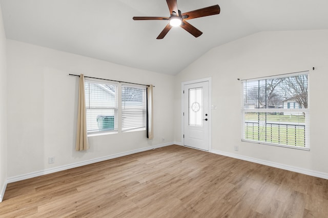 foyer with vaulted ceiling, light hardwood / wood-style floors, and ceiling fan